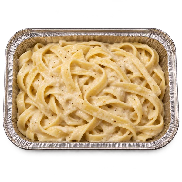 Fettuccine ribbons in creamy Alfredo sauce in a takeaway tray